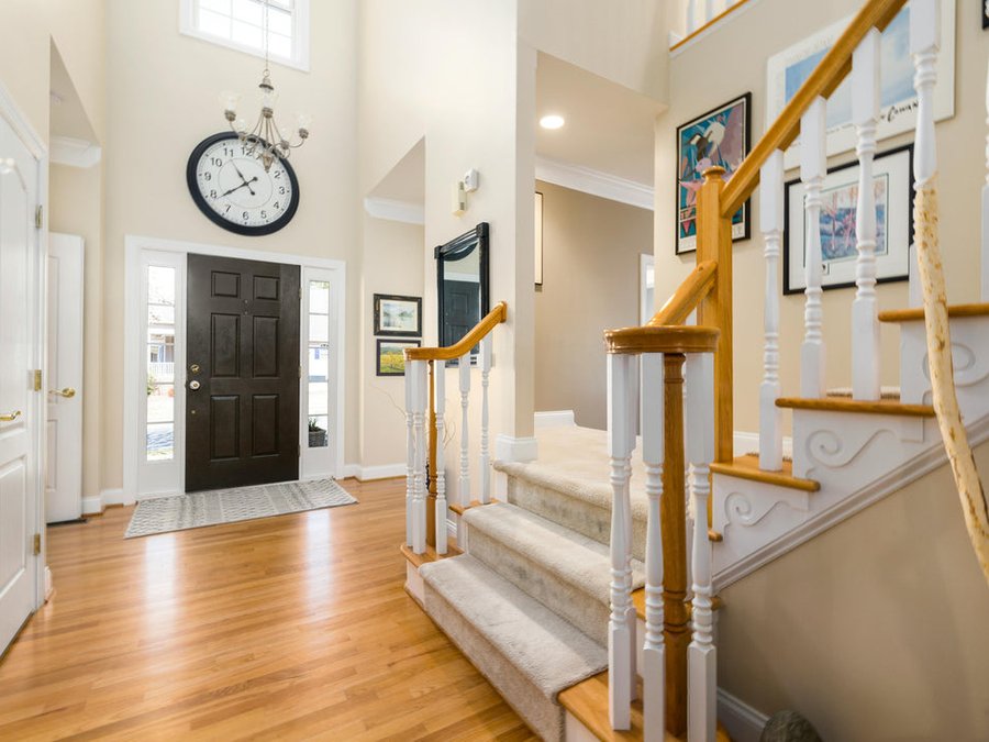 Craftsman installing premium hardwood flooring planks